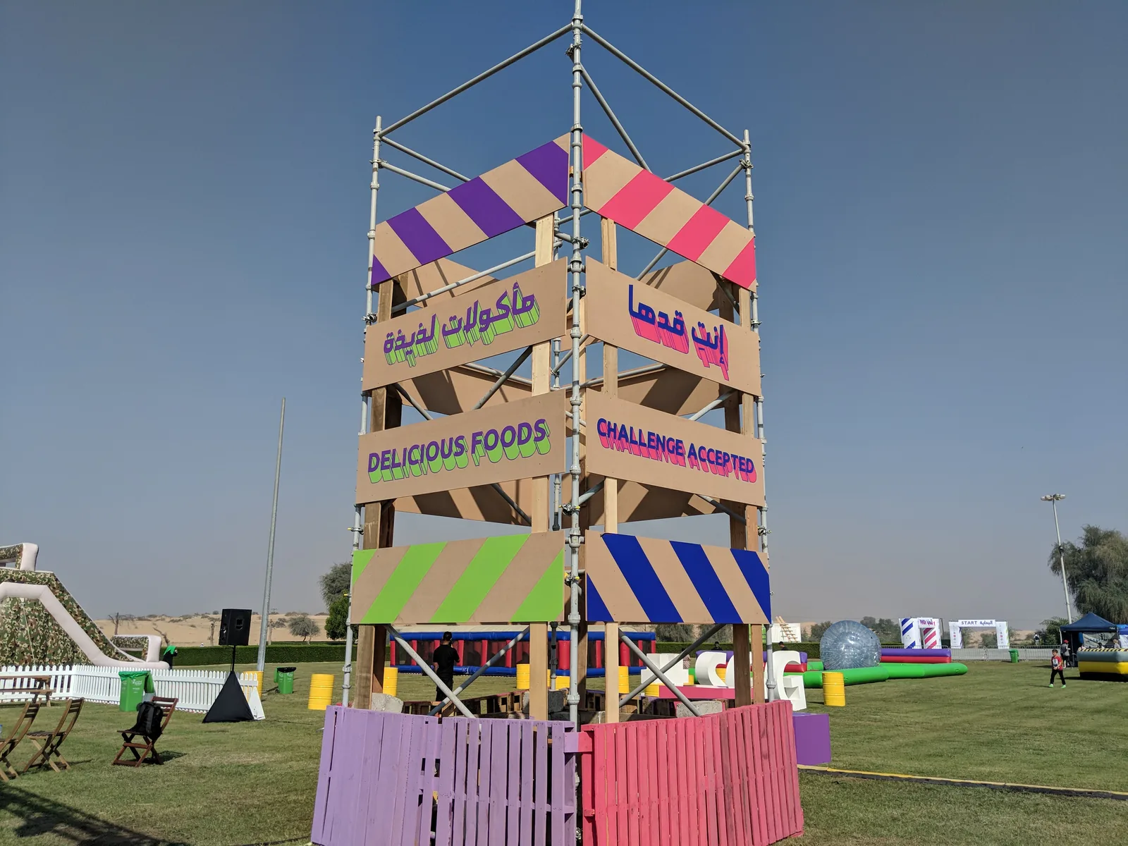 Painted scaffold tower with bilingual signs