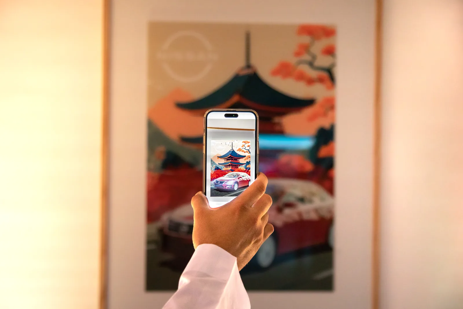 Phone screen bringing a pagoda artwork to life in AR