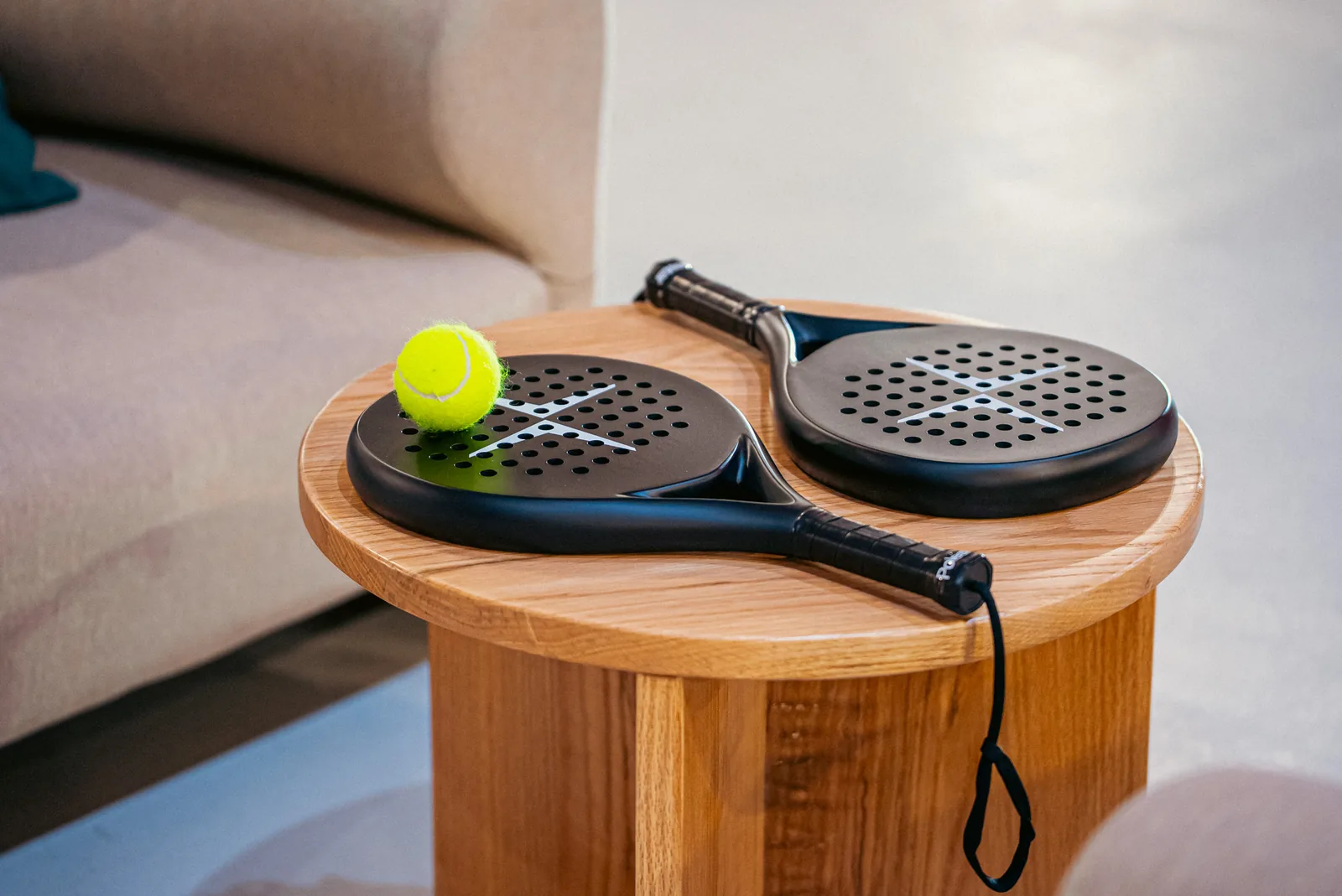 Polestar padel rackets on a side table