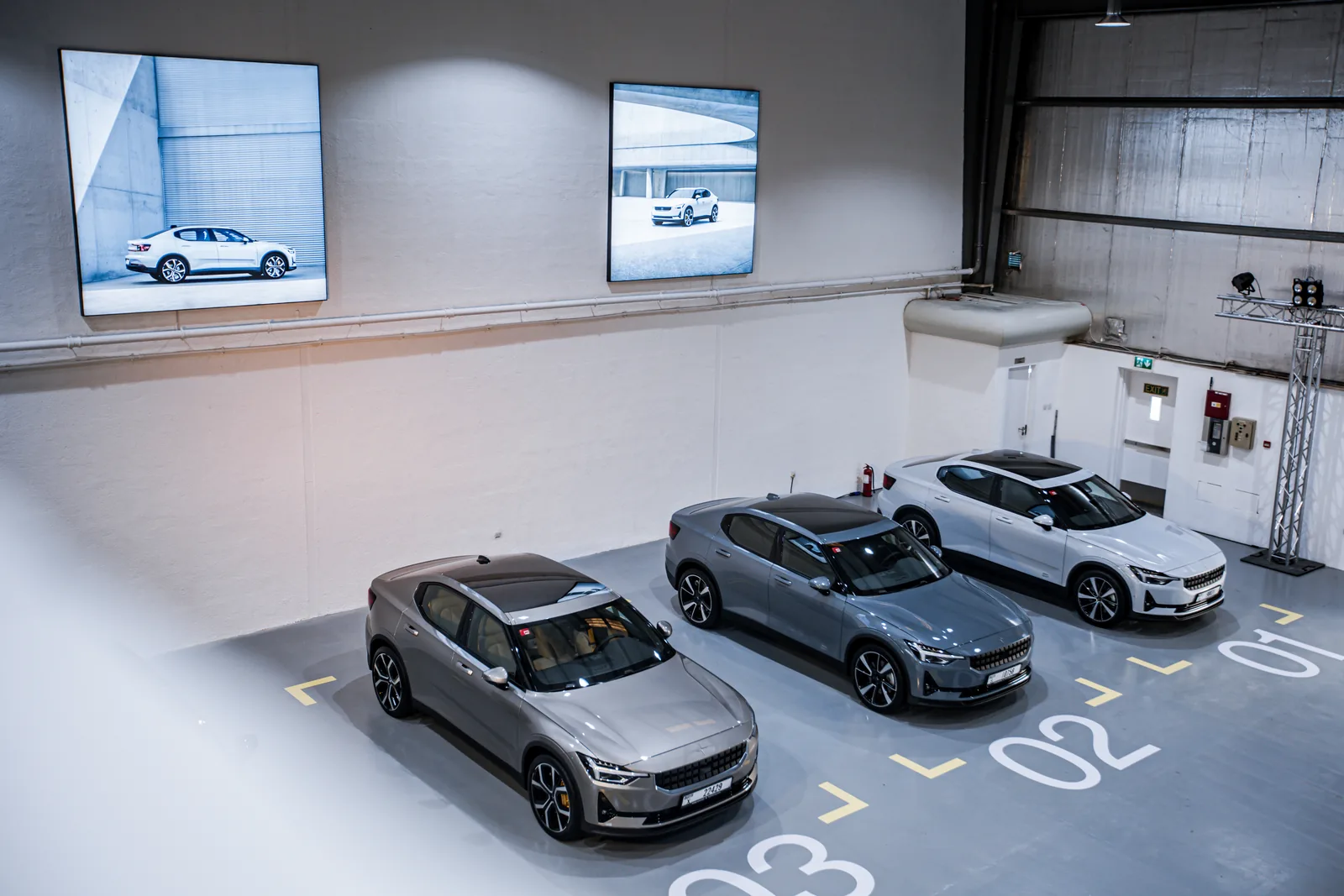 Polestar 2 cars parked in numbered bays from above