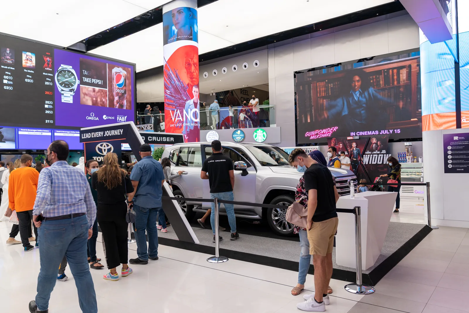 Shoppers gathering around the roadshow stand