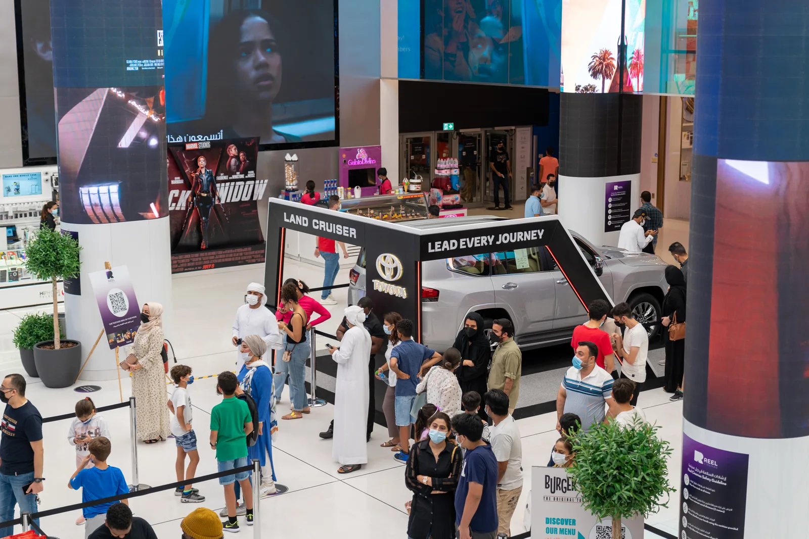 Families visiting the Land Cruiser stand